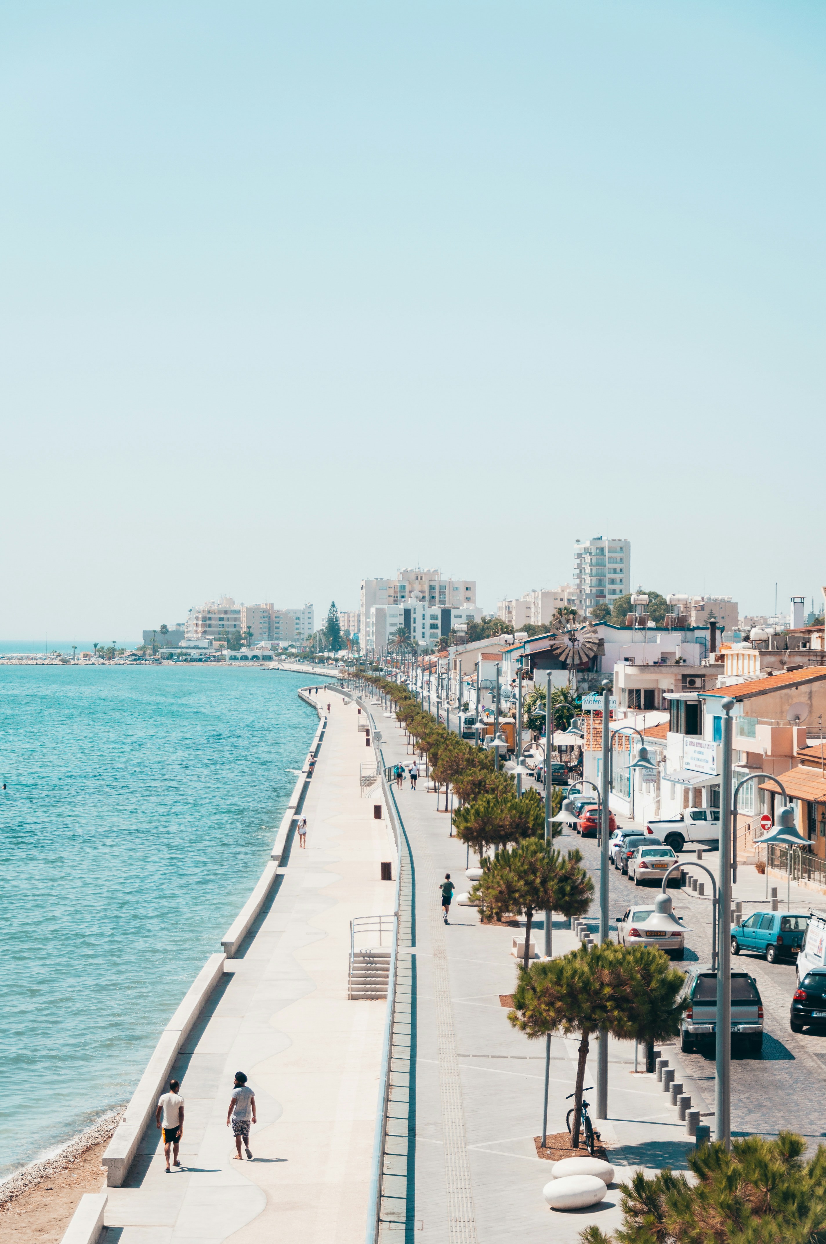 city buildings near body of water during daytime